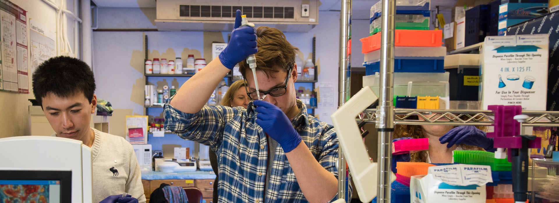 Two students work in a lab.