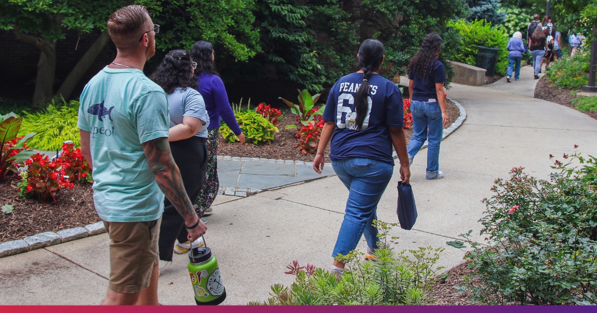 American University Student Ambassador Guiding Campus Tour of Prospective Students