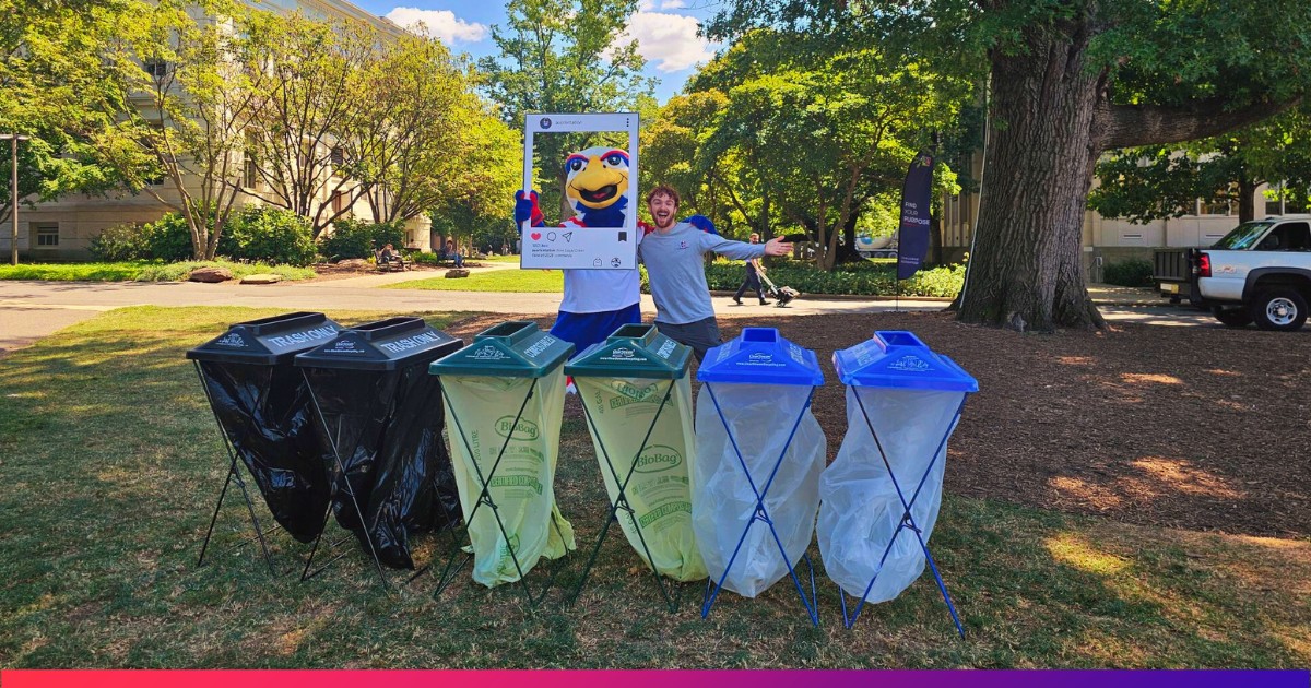 Clawed Z. Eagle Standing with Zero-Waste Staff Member in front of Trash, Recycle, and Compost Bins on Quad