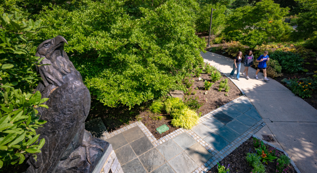 AU Eagle Statue with Students in Background