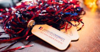 AU Alumni Association red and blue pom-poms