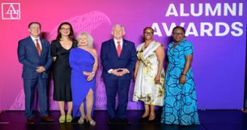 Alumni Awards Recipients pose with AU President Jonathan Alger