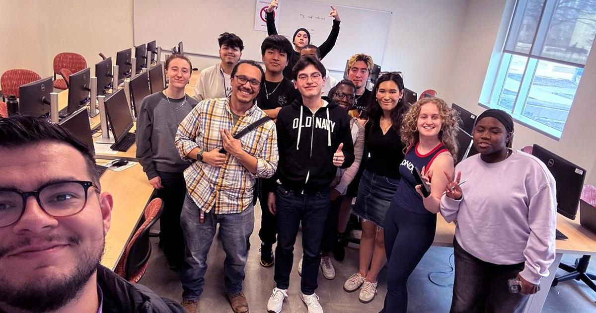 Umana poses with the AI Club at MC Rockville, a club he serve as an advisor for.