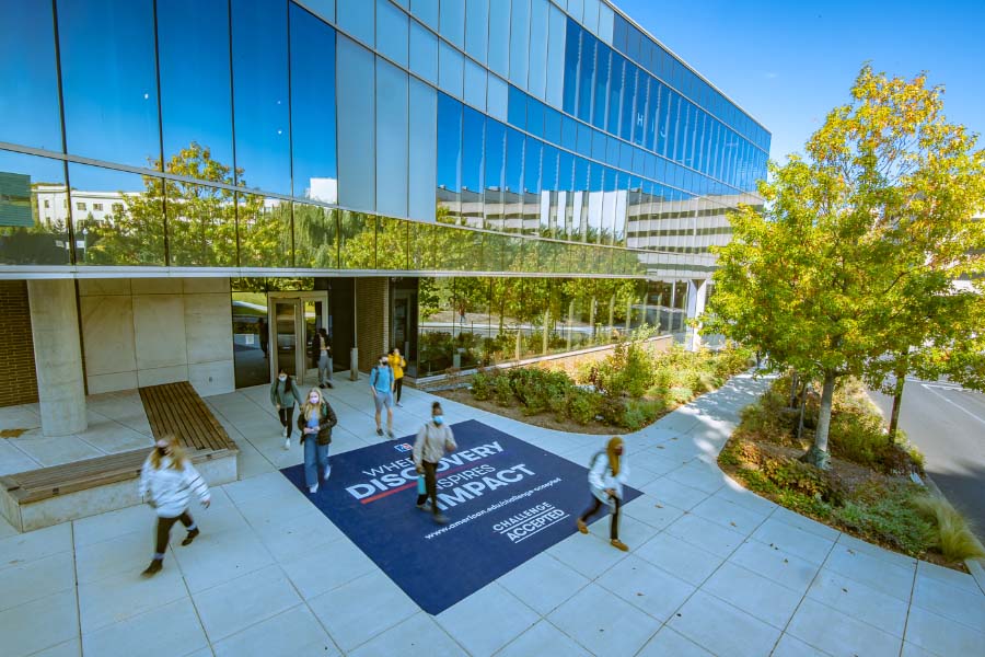 Students walking in and out of AU's Hall of Science