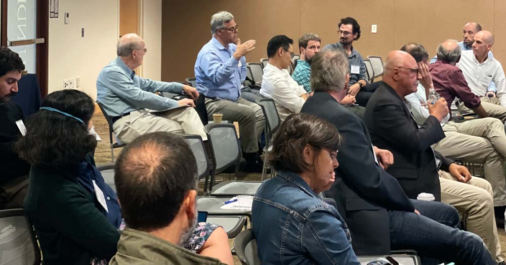 Audience member asks question during Info-Metrics Workshop