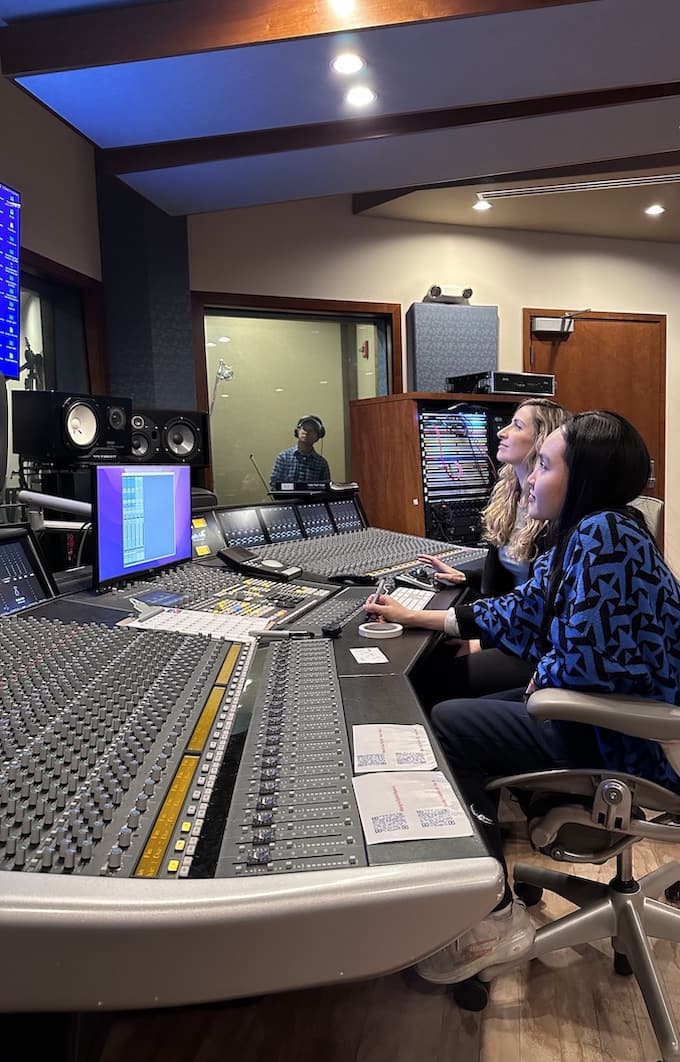 Audio tech students recording violin track.