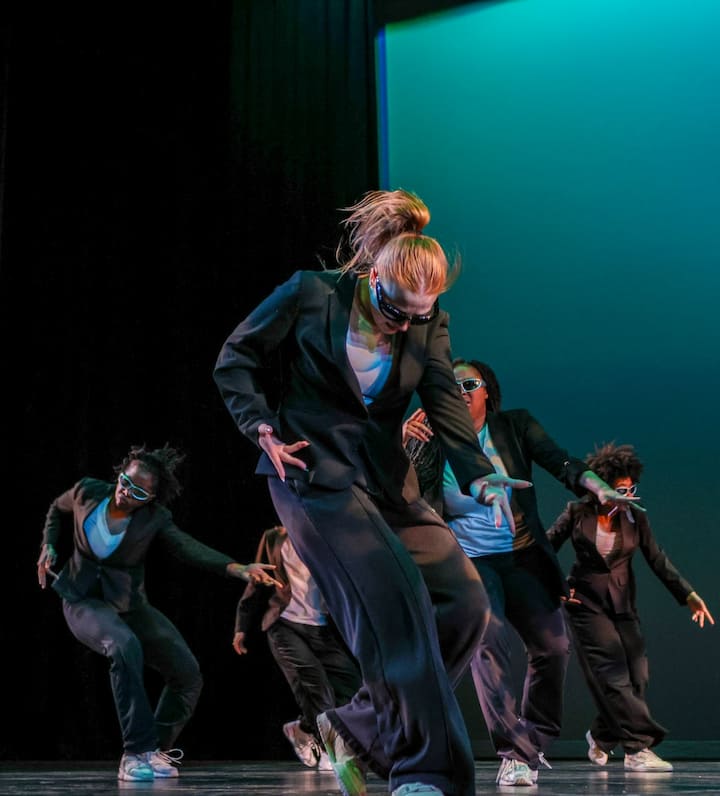 Dance group on stage.