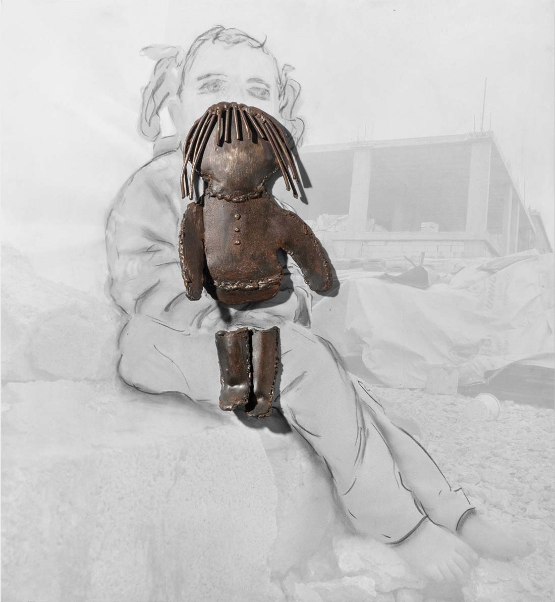 Orna Ben-Ami, Entire Life in a Package 3, 2016. Iron sculpture of a doll on photo of a child holding a doll. Original photo: Reuters, Mohamed Azakir, A Syrian refugee in the Bekaa valley, Lebanon, 2016.