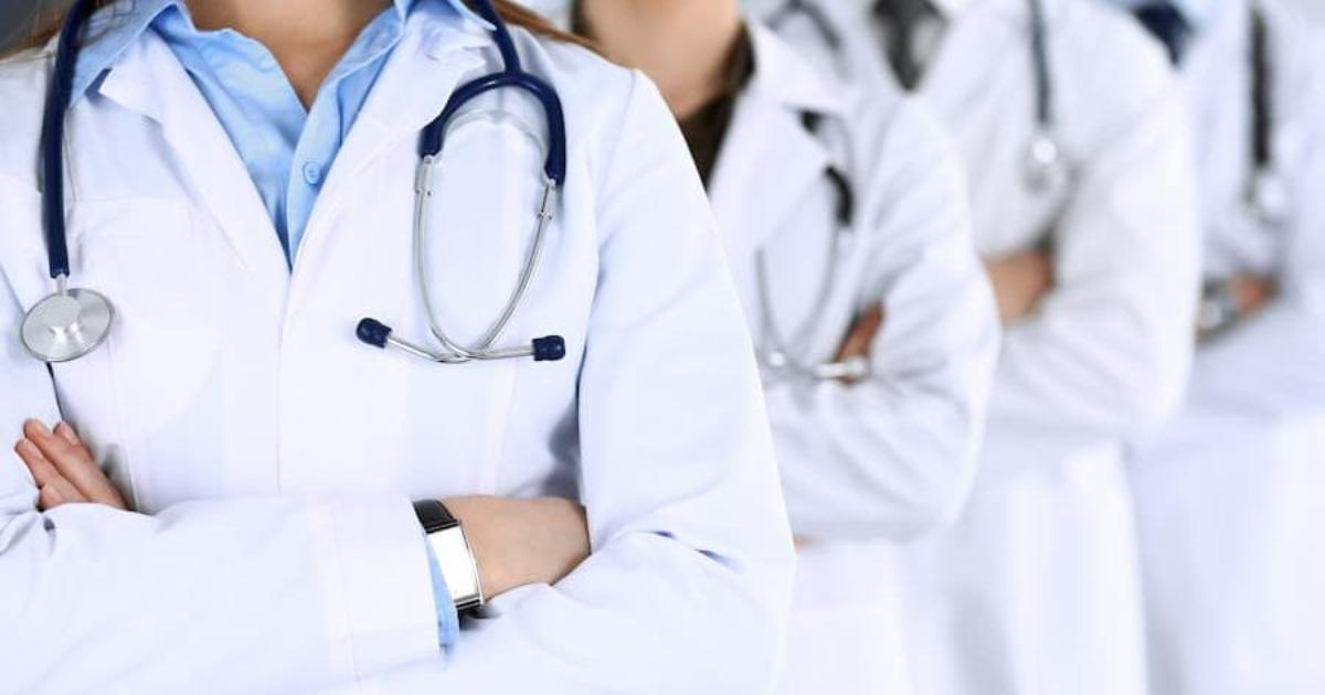 A group of people in lab coats