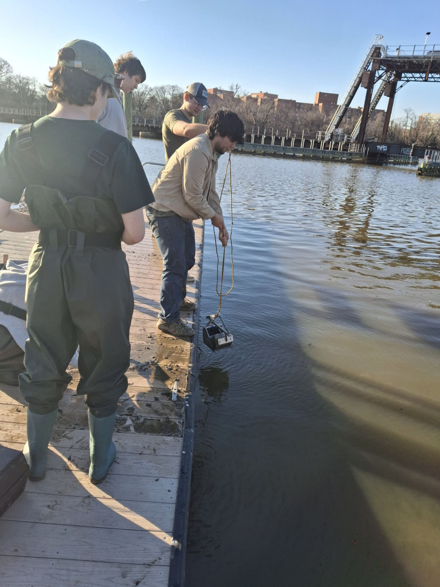 Steve MacAvoy’s students work to detect BPA in the Anacostia River.