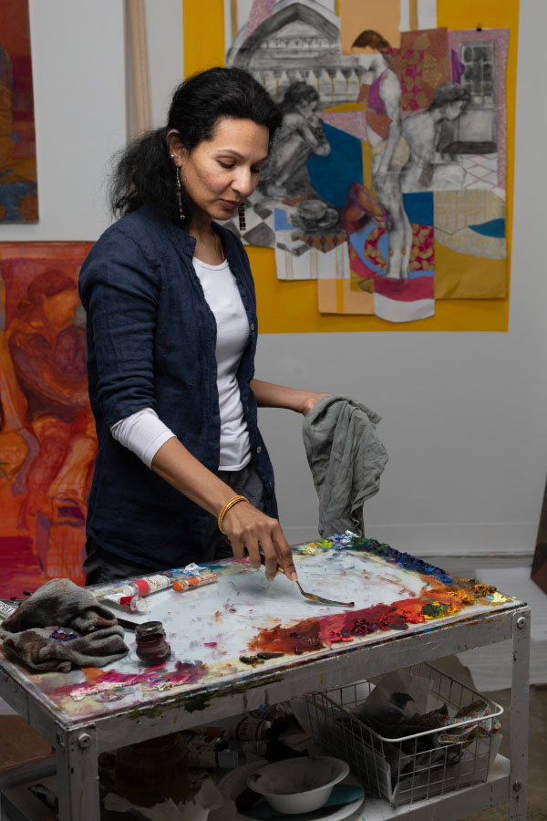 Pooja Campbell mixing paint