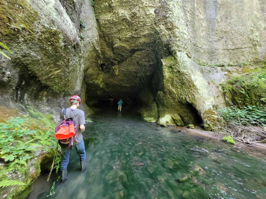 Team enters the cave