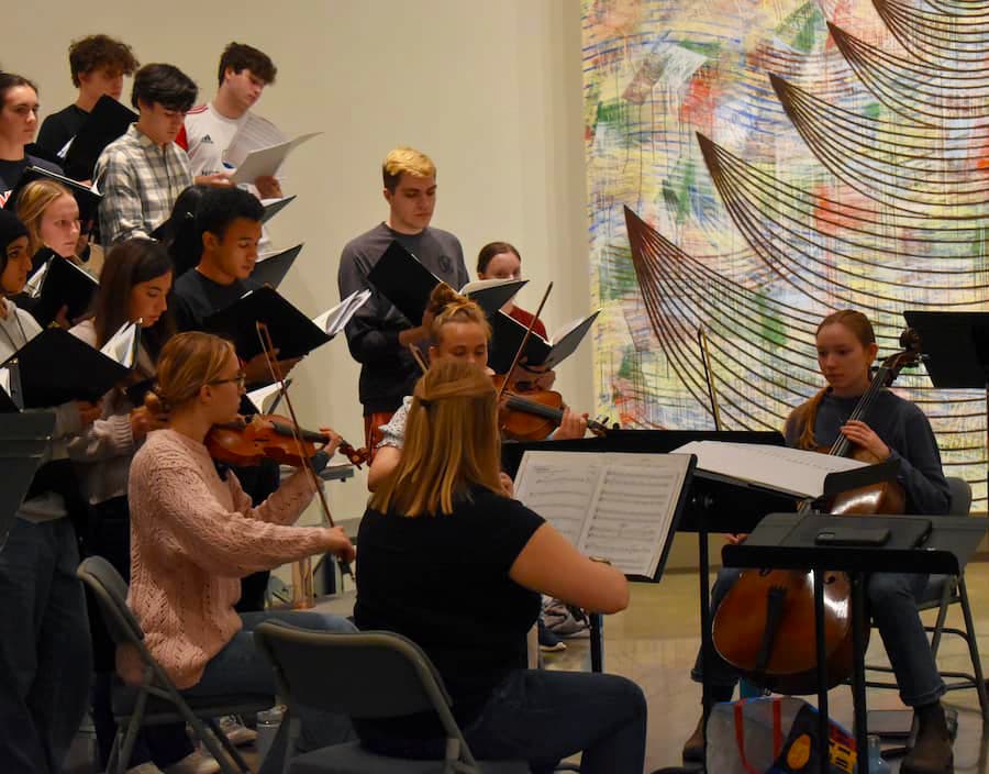 Chamber Singers rehearsing in AU Museum gallery.