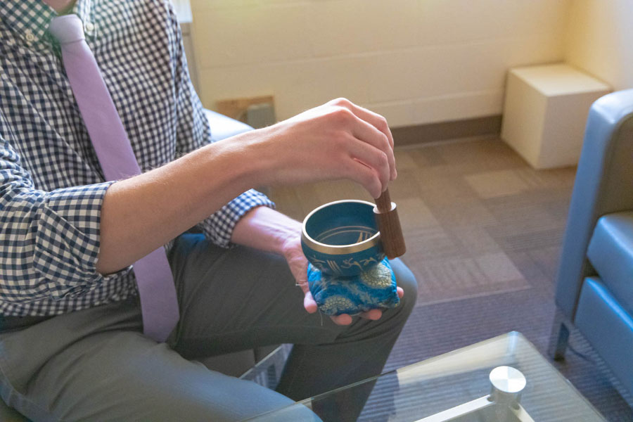 A therapist uses a sound bowl