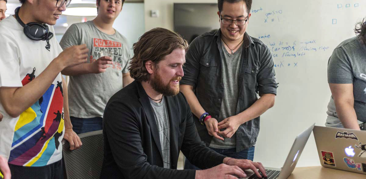 game-center-treanor-wide Mike Treanor demonstrates on computer for students in the Game Lab