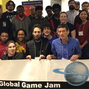 Global Game Jam group holding event banner.