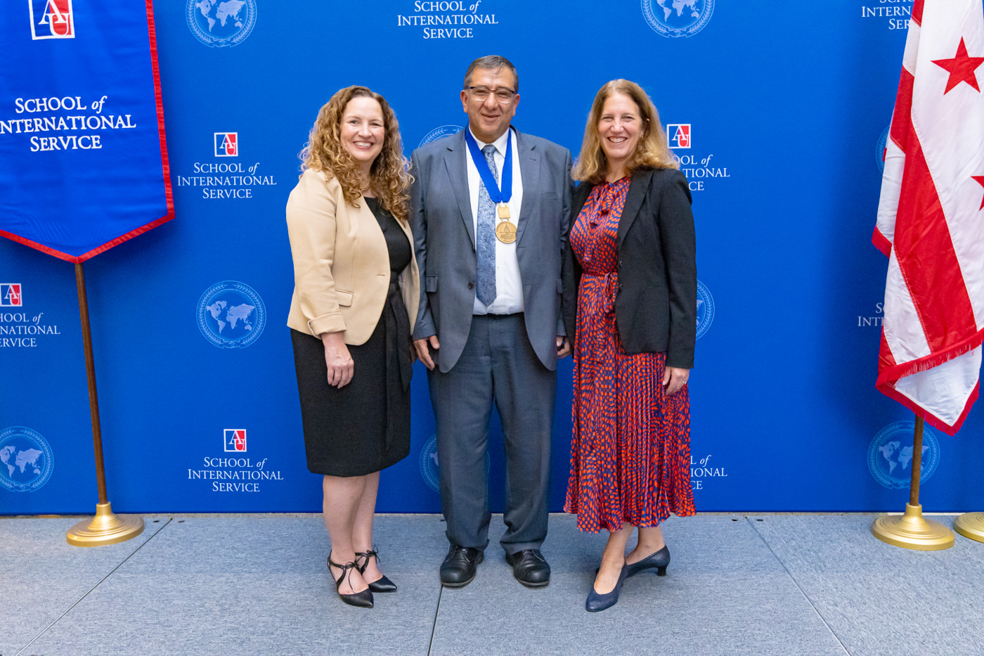 Professor Mohammad Abu-Nimer with Acting Provost Vicky Wilkins and Sylvia Burwell.