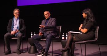 Russell Williams II, SOC/BA ’74, and Barry Josephson, SPA/BA ’78, on stage with  SOC Interim Dean Leena Jayaswal at the Academy Museum of Motion Pictures.