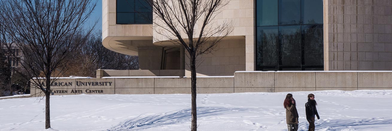 Students walking in front of the Katzen Arts Center in the snow