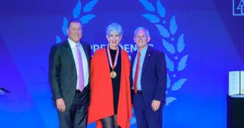 Sharon Wolpoff, President Alger, and Charlie Lydecker stand together for a photo.