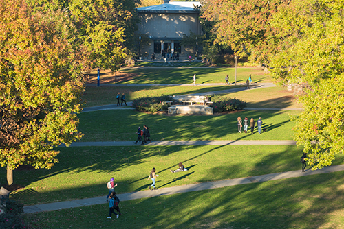 People walking along campus during the fall