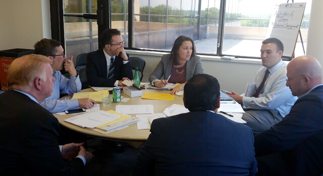 KCGC members discussing cyber concepts.