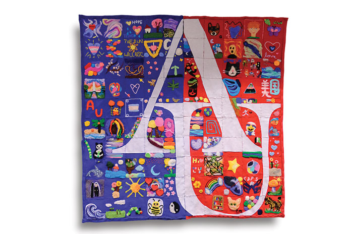 Threads of Hope quilt with AU mark in the center