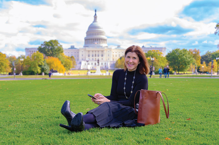Amy Dacey sitting on the grass on the National Mall