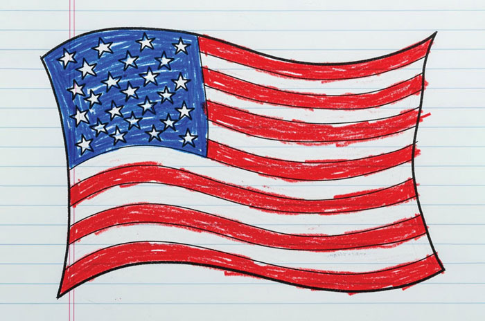 a hand-drawn US flag on a piece of notebook paper