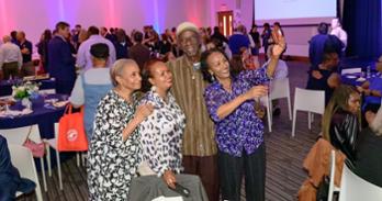 staff celebrate at a reception for retirees