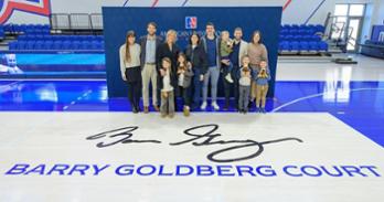 The Goldberg family stands on Barry Goldberg Court on February 13. Photo by Jeff Watts.