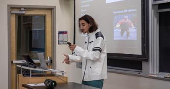 Kayvaan Carillo raps at the front of a classroom in the Don Myers Technology and Innovation Building. Photo by Julia Gibson.