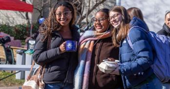 Students pose for a photo at Thank Clawed It's Wednesday on the quad. Photo by Julia Gibson.