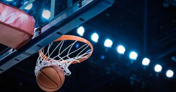Basketball swishes through the net. Getty Image.