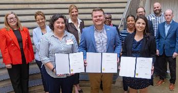 Regina Curran, Jacob Wilson, and Emma Godel, winners of the Faculty and Staff Collaboration Award