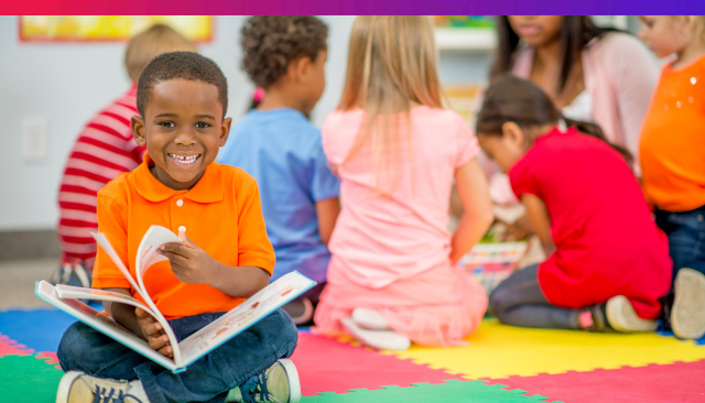 Kid is reading a book