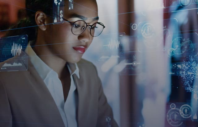 Woman working with data visualizations.