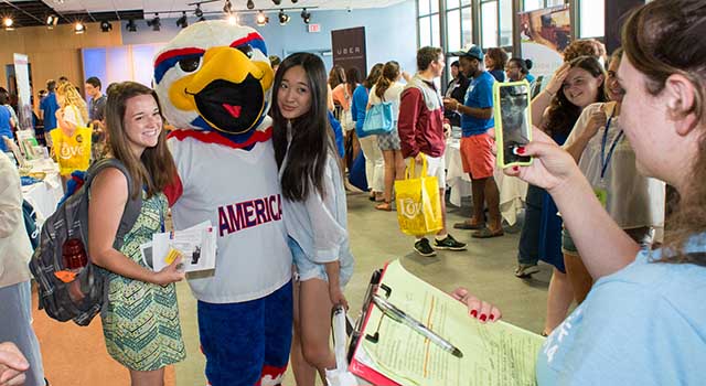 Clawed the Eagle poses with students