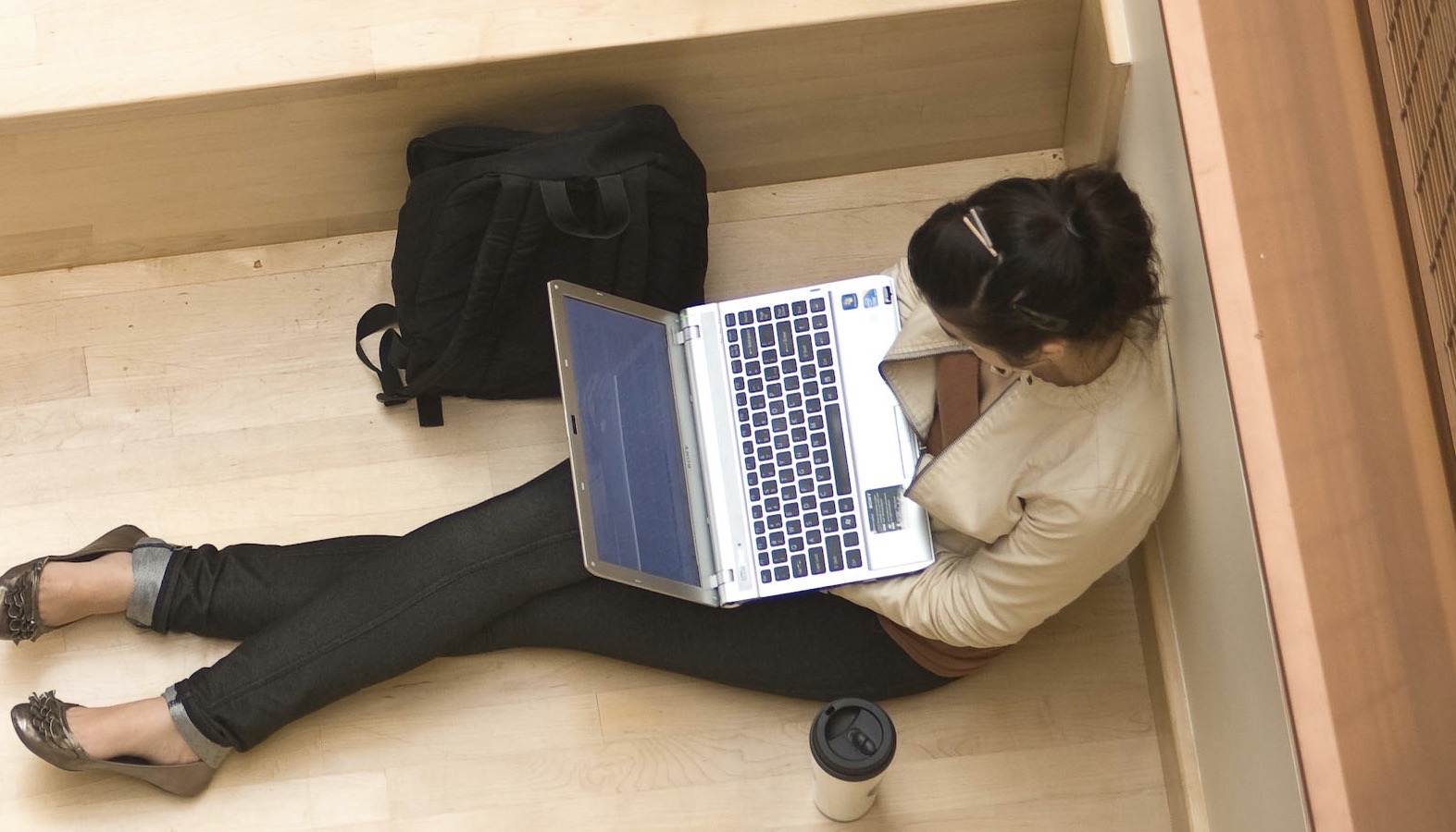 Student with Laptop Preparing to Attend a Virtual Coaching Session