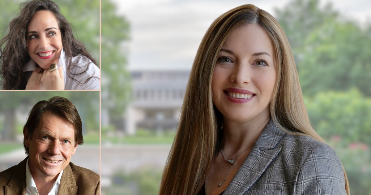 Two women and one man smiling