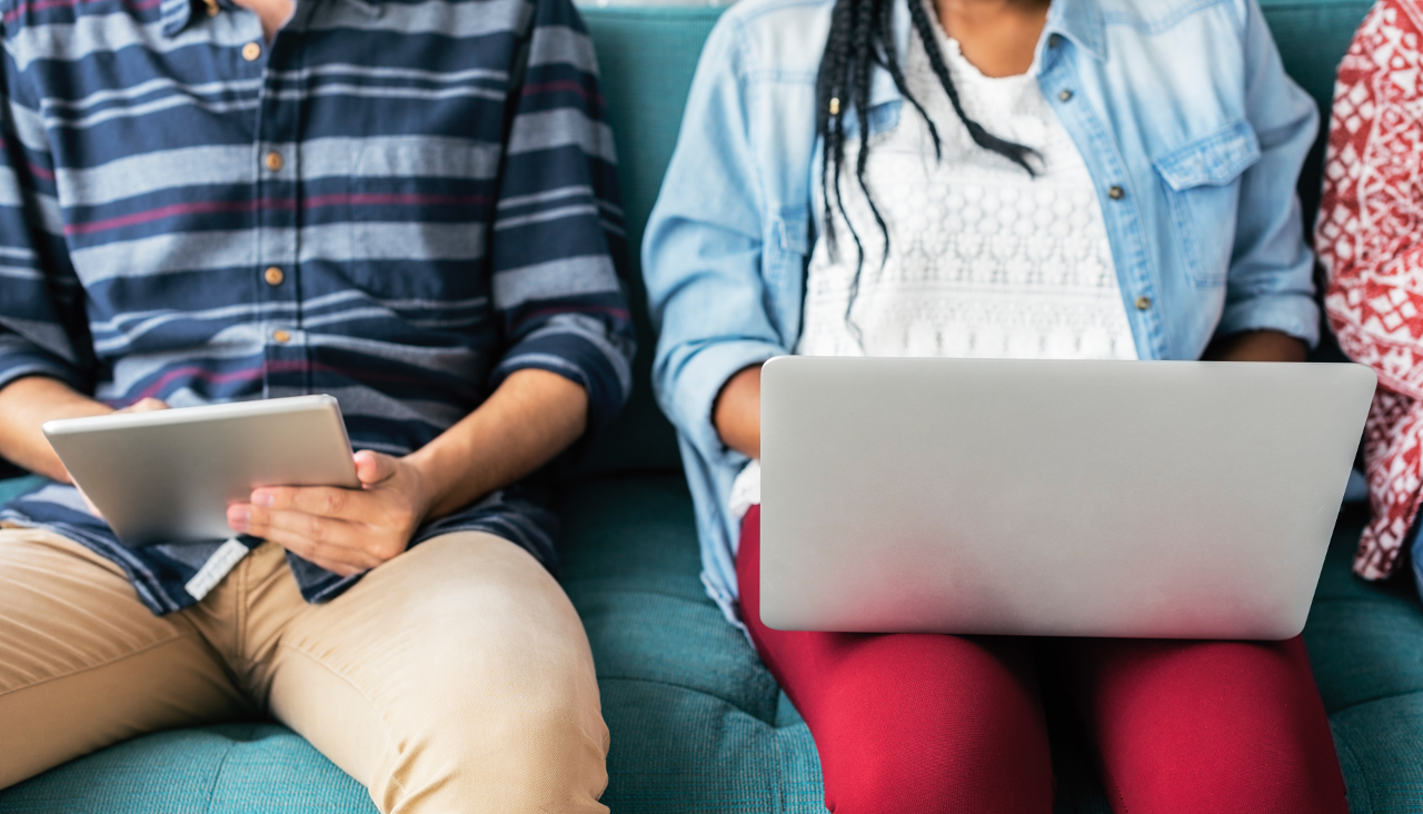 Two students looking at mobile devices