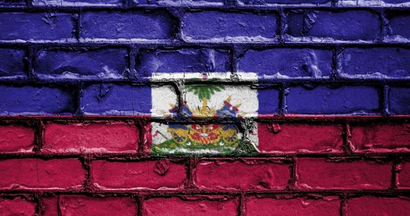 Haitian flag painted on a brick wall