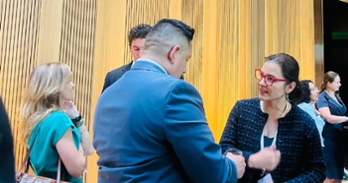 students talking at an event