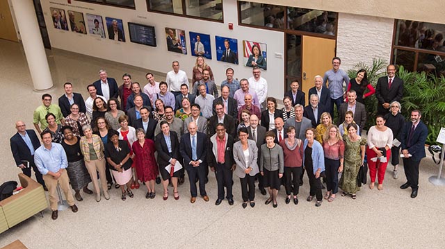 group of faculty from the School of International Service in the atrium