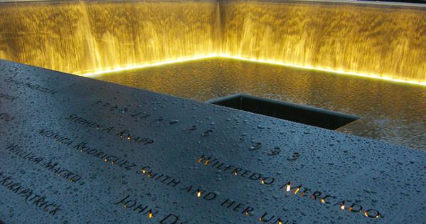 rain drops along the names of those who lost their lives on Sept. 11 with the waterfall feature at Ground Zero