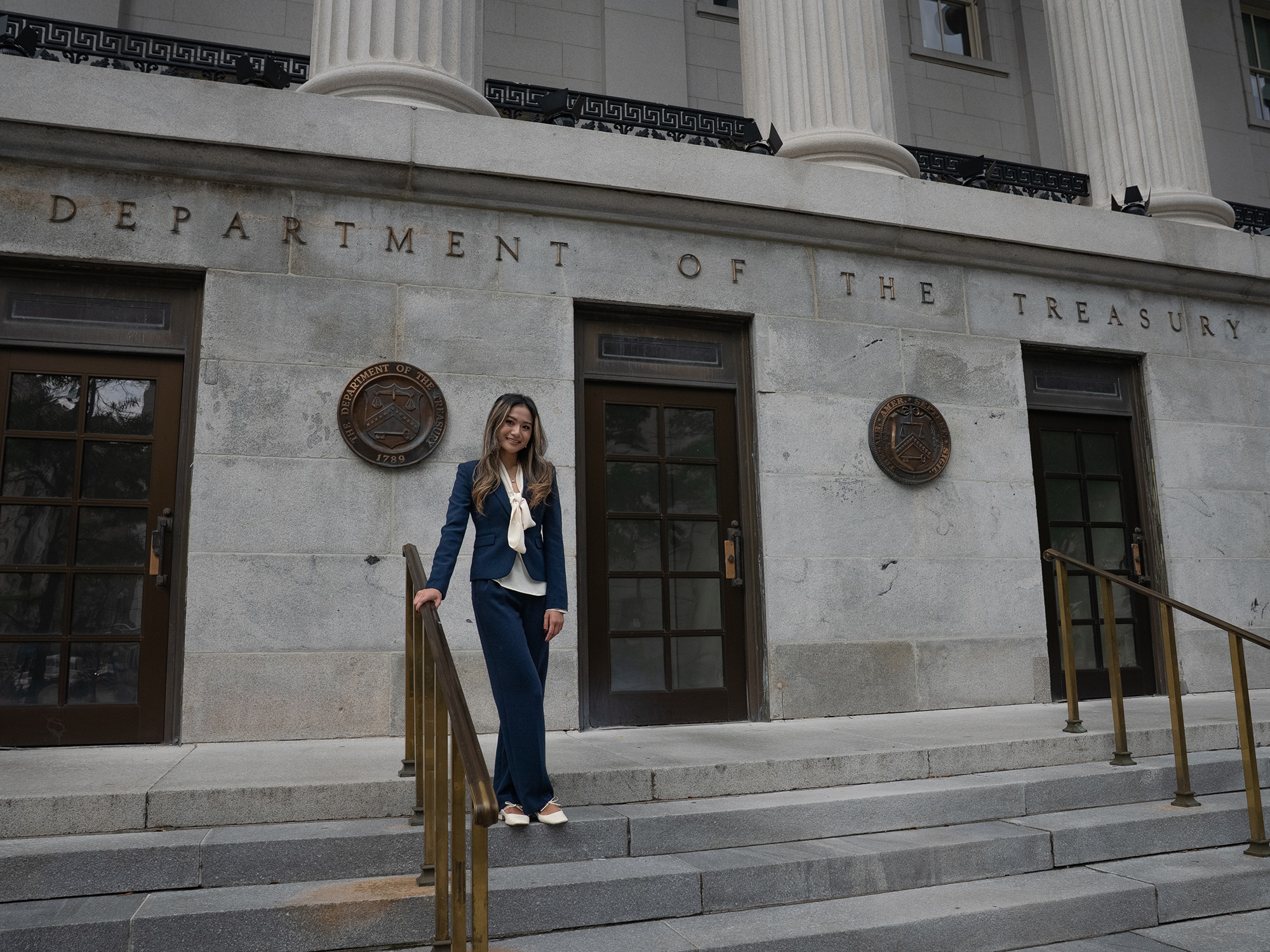 Abi Ha smiles for a photo outside the US Department of Treasury