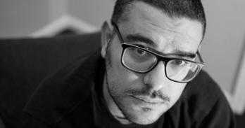 Black and white closeup photo of Alex Ward