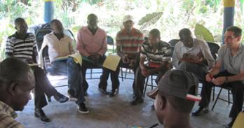 Professor Anthony Wanis-St. John speaks with a group of men in Haiti