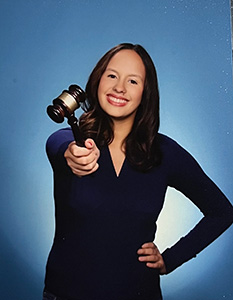 Emily Chavez holds a gavel