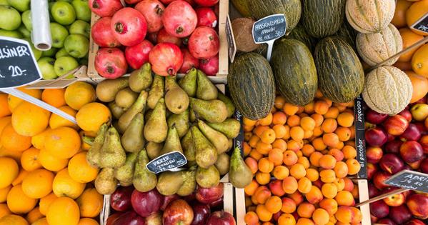 Baskets of pomegranates, oranges, apples, and pears